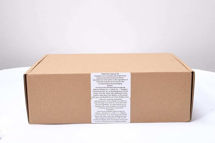 Closed brown cardboard box packaging for women's makeup kit with product label on white background