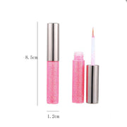Pink glitter liquid eyeliner with metallic shimmer and felt tip applicator for smooth, vibrant eye makeup.