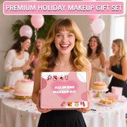 Smiling woman holding pink All-in-One Makeup Kit box at festive party with balloons and cakes in background