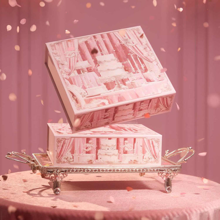 Strawberry Cupid Makeup set in elegant pink packaging on decorative tray with confetti background