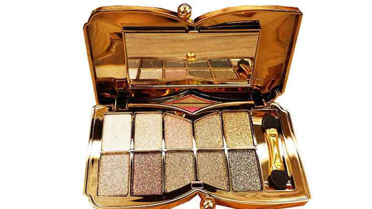 10-color eyeshadow palette with gold tones, shimmer and sparkle, highly pigmented, long-lasting, includes mirror and applicator.