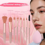 All-in-One Makeup Set with professional brushes and pink beauty sponge on model's face