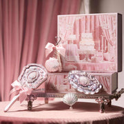Strawberry Cupid Makeup set with decorative vintage-style mirror and accessories in pink packaging, elegant and playful beauty cosmetics.