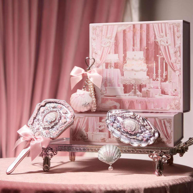 Strawberry Cupid Makeup set with decorative vintage-style mirror and accessories in pink packaging, elegant and playful beauty cosmetics.