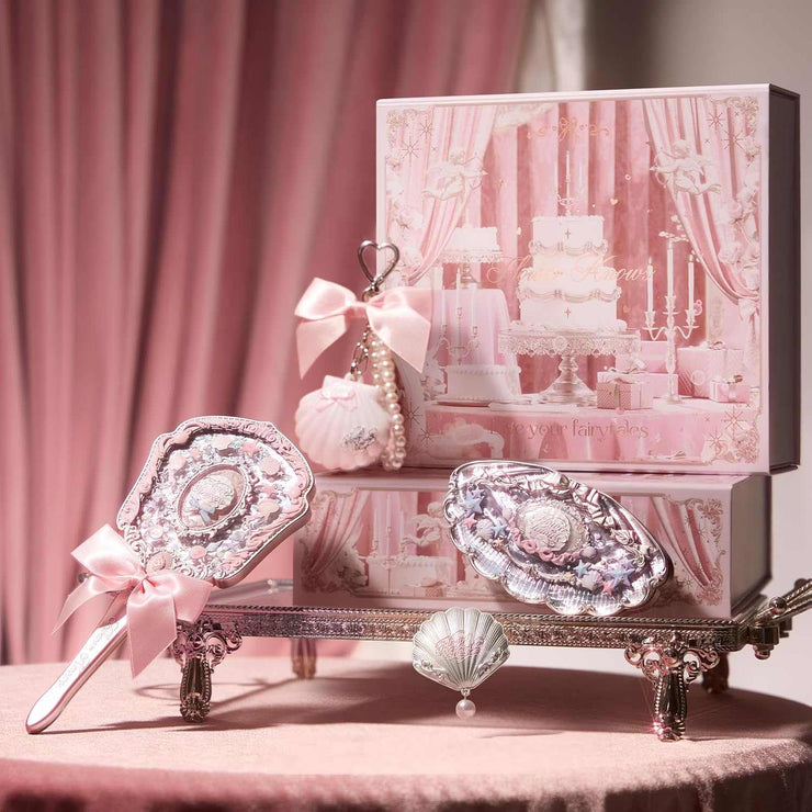 Strawberry Cupid Makeup set with decorative vintage-style mirror and accessories in pink packaging, elegant and playful beauty cosmetics.