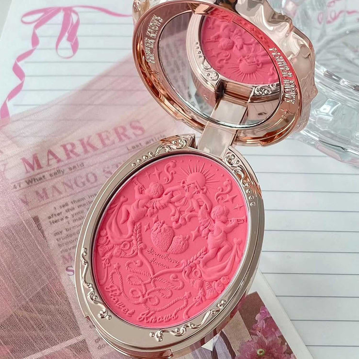 Strawberry Rococo Embossed Blush compact with intricate rose gold design and pink embossed powder for radiant cheeks