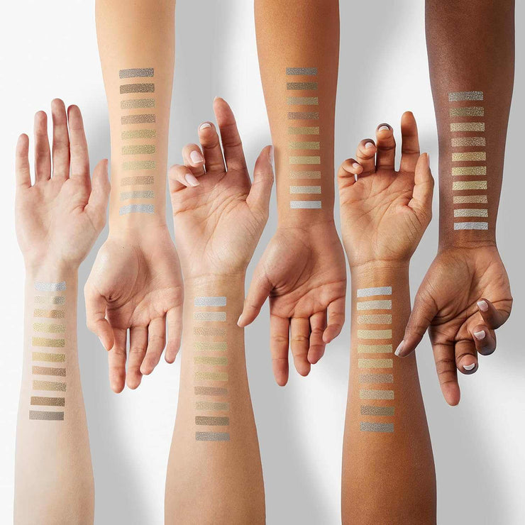 10-color eyeshadow palette swatches on diverse skin tones showing highly pigmented shimmer and matte shades