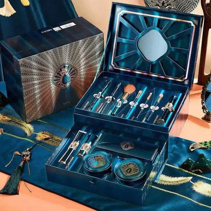 Luxury makeup gift set with 12 pieces including brushes, BB cushion, and eyeshadow palette in elegant blue packaging