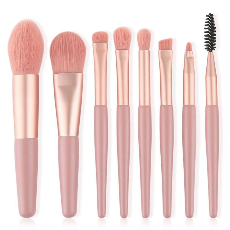 Full makeup brush set for women with pink handles, including various brushes for eyeshadow, eyeliner, mascara, and face application