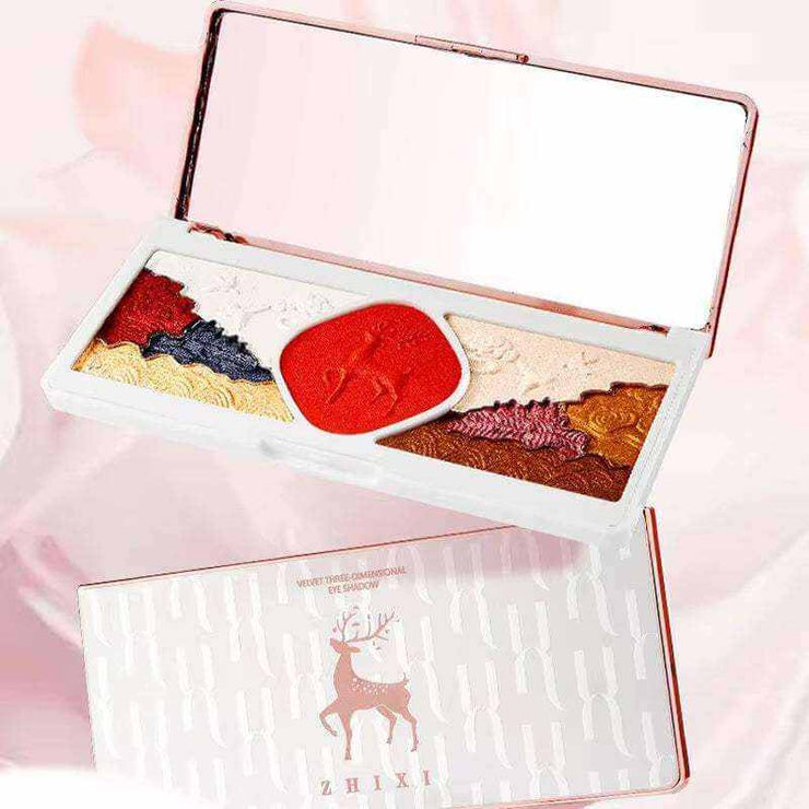 Compact makeup set box with colorful eyeshadows and mirror featuring a deer design on the packaging