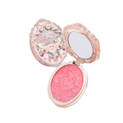 Strawberry Rococo Embossed Blush compact with intricate floral design and mirror, silky rosy pink powder for radiant cheeks.