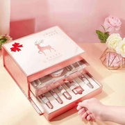 Elegant 20-piece pink makeup set box with drawers containing lipsticks and skincare products, decorative flowers nearby